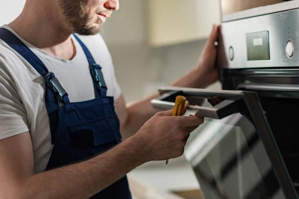 Technician reviewing an oven diagnosis on a tablet